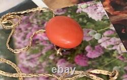 Art deco gold necklace with large natural coral bead
