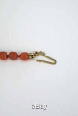 Vintage natural Momo coral bead necklace with carved monkey and dog heads 1970s
